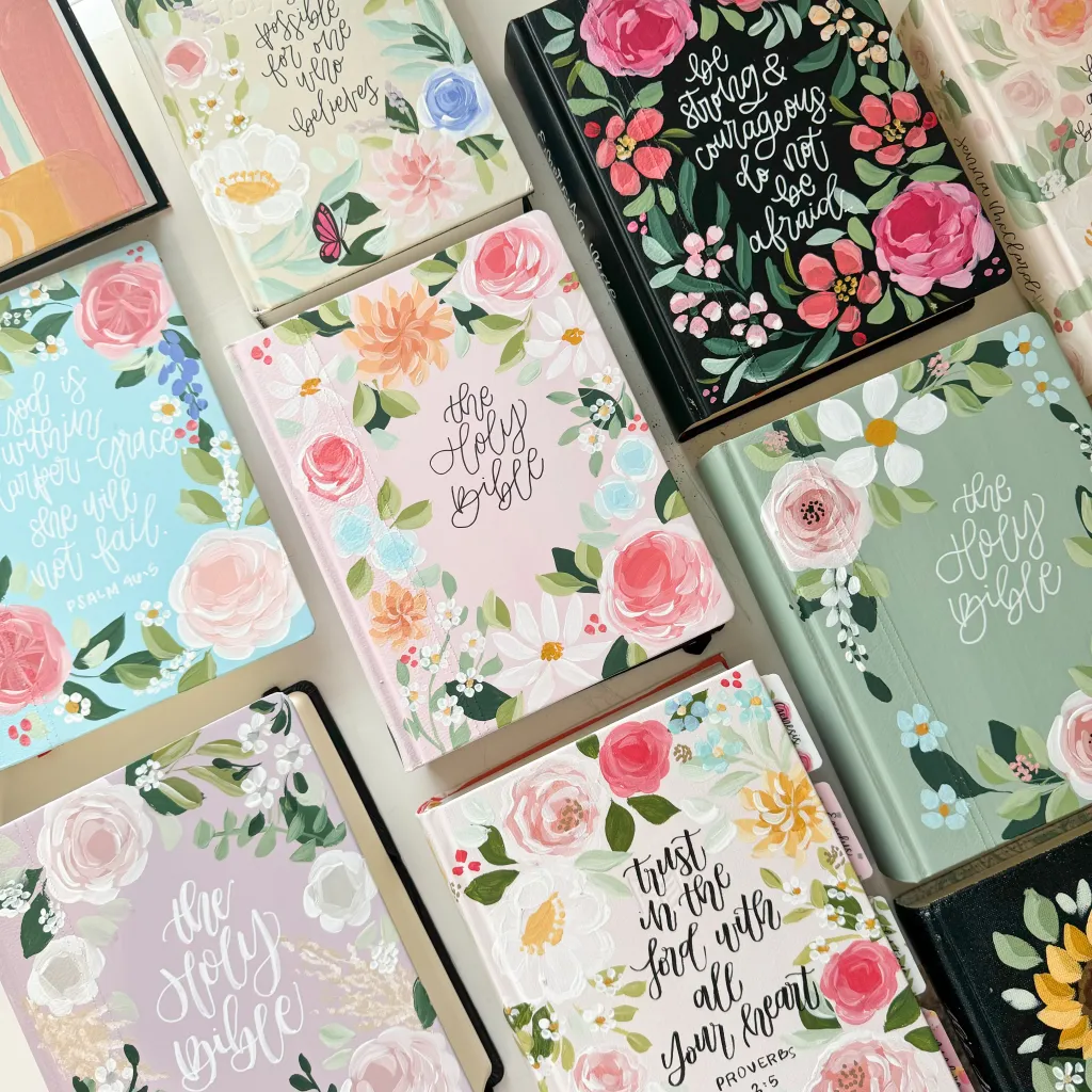 Collection of beautifully hand-painted custom Bibles with floral designs by Rosycheeks Lettering