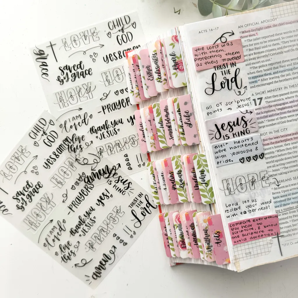Bible journaling supplies including tabs, stickers, and painted covers